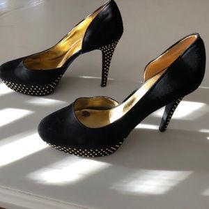 Black suede heels with gold stud accents